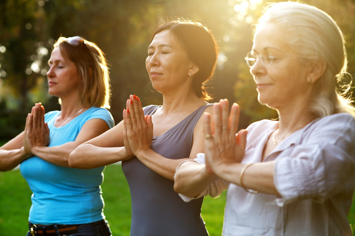 Women exercising together outdoors